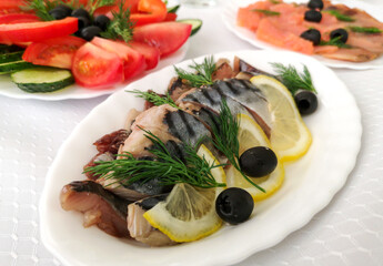 Dishes and fish salads on the festive table
