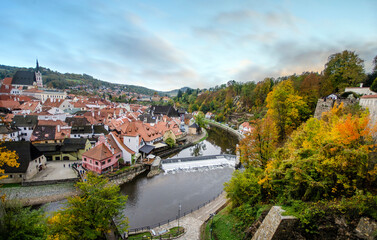 Fototapeta na wymiar View of Cesky Krumlov, Czech Republic, the old medieval town. UNESCO World Heritage Site. Beautiful view to church and castle. One of the famous sights in the country. 