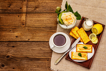 Healthy breakfast. Cup of coffee (black tea), milk, crackers with butter and salmon