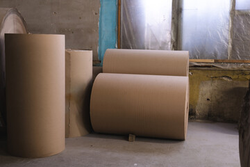 Big Stack of Printing Paper Rolls in Warehouse. The concept of production of paper and paperboard.