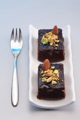 Brownie with almond and pistachio nut toppings