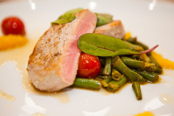 Served delicious food in the restaurant, salads, dishes, meat, sauces. 
