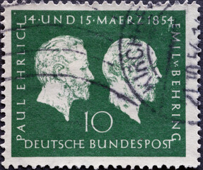 GERMANY - CIRCA 1954: this postage stamp shows a protrait by Prof. Paul Ehrlich and Emil von...