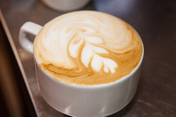 cup of cappuccino with cream