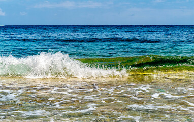 Sea scape with small wave splash in front © Maksym