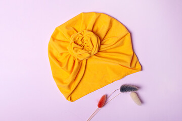 Delicate orange turban for women, girls or baby. Turban fashion or bandana hair accessories for the beach and travel.