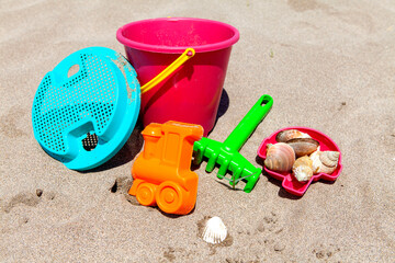 Fototapeta na wymiar Toys for little kids on the beach on sunny day