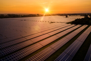 Sunrise over a modern solar farm