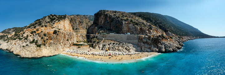 Kaputas beach. People enjoying sun and sea at the beautiful turquoise sea and sandy beach of Kaputas. Bird's eye view aerial drone shooting. Mediterranean, Kas / Antalya – TURKEY