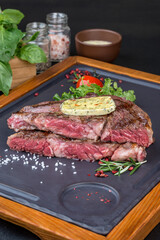 Sliced steak with fresh herbs and vegetables