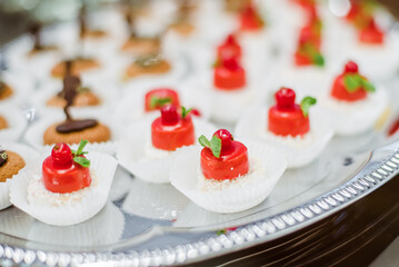 Сatering banquet table with different snacks and desserts