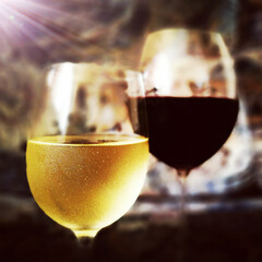 Glasses dry red and white wine like as a still life.