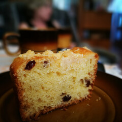 Yeast cake with crumble and raisins. And a cup of tasty coffee.