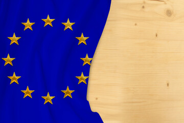 silk colored national flag of the European Union, empty wooden mocap for text, concept of tourism,...