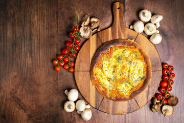 Quattro Formaggi/Four Cheese Pizza on a wooden pizza board. Close Up pizza cheese: blue cheese, parmesan, mozzarella, gorgonzola. Concept of homemade pizza with free space for your text/decoration. 