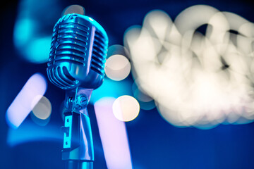 close-up stage retro microphone, blue tint, different focus