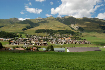 Small village of Zuoz and Swiss Alps, tourist resort in Engadin valley, Graubunden canton, Maloja...