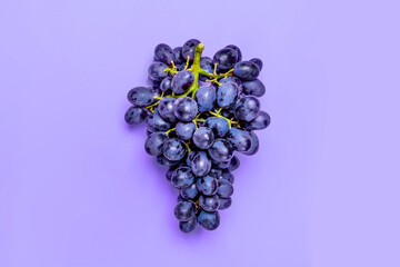 Natural organic black juicy grapes on  trend violet background  Top View Flat Lay. Rustic Style....