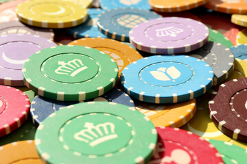 Colorful casino chips background. Many colored chips backdrop. Lot multicolor assorted gambling...