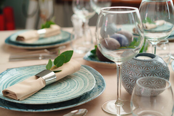 Luxury green table setting decorated with candles