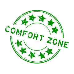 Grunge green comfort zone word with star icon round rubber seal stamp on white background