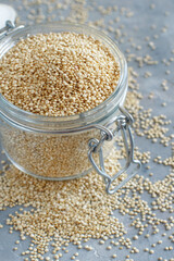 Raw dry white quinoa seeds close up