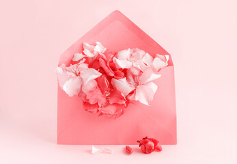 Red envelope full of flowers  over a pink background