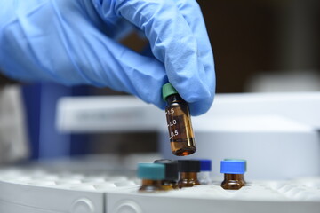 scientist in laboratory with test tubes