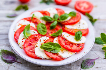 Caprese salad with tomatoes and mozzarella. Italian food.