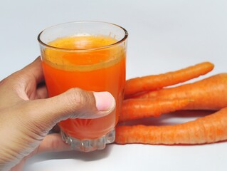 Carrot juice isolated on white background