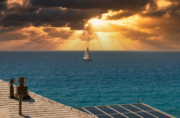 Fototapeten sailing boat during sunrise in front of deiva liguria , italy © manola72
