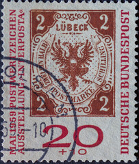 GERMANY - CIRCA 1951: a postage stamp showing an illustration of the historical postage stamp Lübeck two and a half Schilling occasion of the international stamp exhibition INTERPOSTA 1959