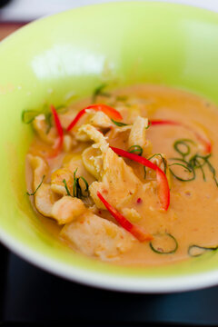 Closeup of bowl with hot spicy Paneng red curry chicken