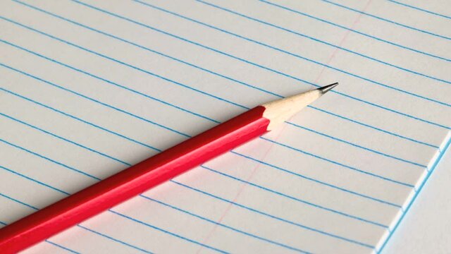 Pencil on a lined pad of paper