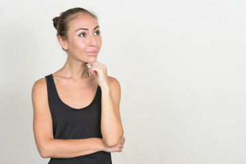 Portrait of young woman with brown hair thinking