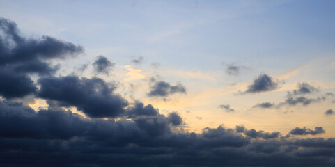 Fototapeta na wymiar Dark clouds before rain on blue sky background