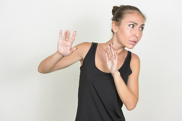 Stressed young woman with brown hair looking scared