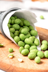 Hot Wasabi Peanuts. Wasabi coated peanuts close-up. Green spicy Japanese snack.