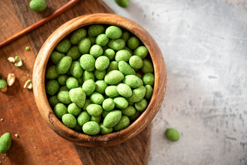 Hot Wasabi Peanuts. Wasabi coated peanuts close-up. Green spicy Japanese snack.