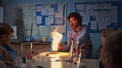School Chemistry Classroom: Engrossed Children Watch How Enthusiastic Teacher Shows Science...