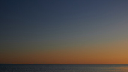 beautiful sky and black sea sky line at sunset