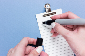 Important business checklist, planning for shopping reminder or project priority task list on blue...