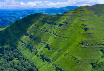 Landscape from a drone in Portillo de la Sia. Mowing meadows, pasiegas cabins and beech forests. Community of Cantabria. Spain.Europe