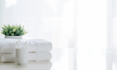 Clean white towel on white table, copy space.