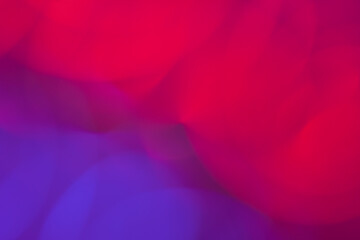 Colorful abstract circular pattern shape of red purple and pink background or wallpaper with bokeh lights out of focus