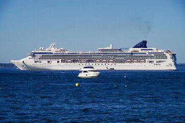 Modern NCL Norwegian Cruise Line cruiseship or cruise ship liner Norwegian Gem anchoring in bay on...