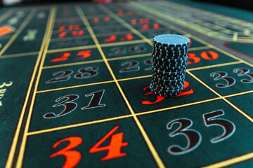 stacks of chips. gambling, casino roulette, bet on black in las vegas. white ball.