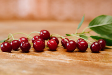 Fresh cherry on plate on wooden background. fresh ripe cherries. sweet cherries.