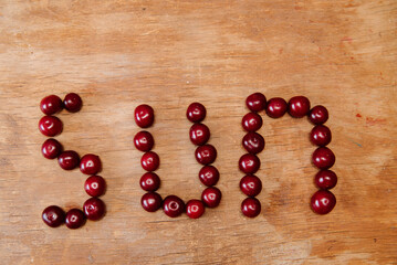 Fresh cherry on wooden background. fresh ripe cherries. sweet cherries.