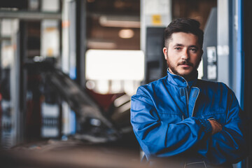 Portrait of a car mechanic in a garage
Brutal bearded male car repairman